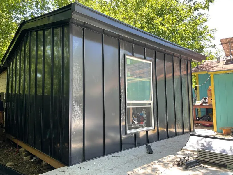 Black standing seam metal wall panels for Roof Inspection in Edgewater